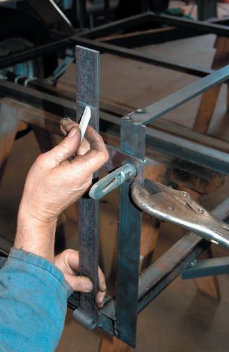 Mark cut on hinge after clamping toggle strap.