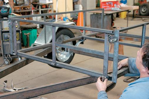 Clamp hinges to bottom of frame.