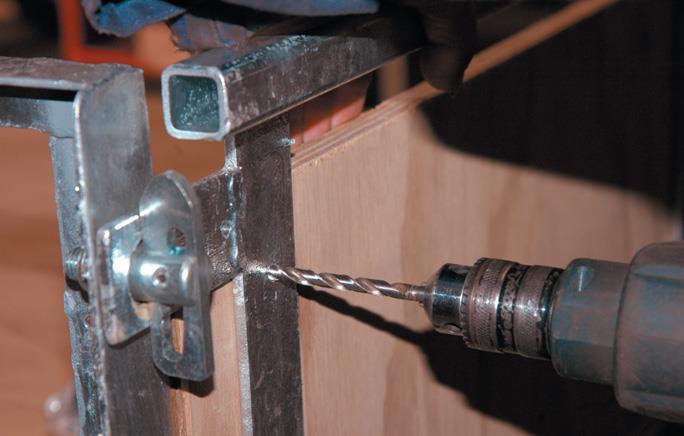 Drill tailgate hinges.