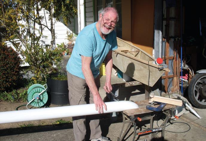 Stuart works on stainless rod for outrigger hook in the ama