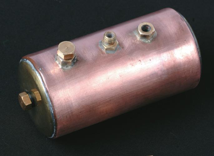 From left, boiler holes for level check (in end), ﬁlling, steam outlet, safety valve.