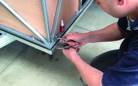 M8 bolts secure frame to chassis