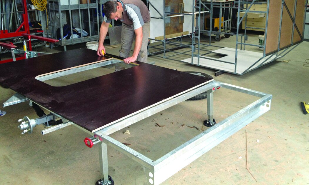 Ply floor sheet with damage-resistant top