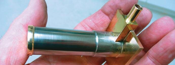 Displacement piston sleeve and air port