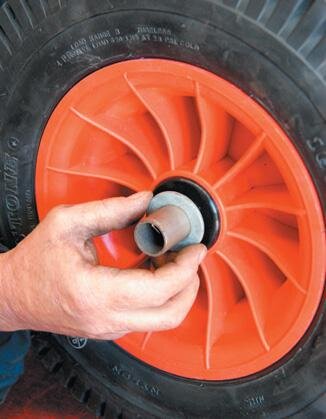 Axle stub in bush, with rubbing washer