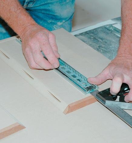 Fitting the drawer slides. Allow 18mm for the drawer fron