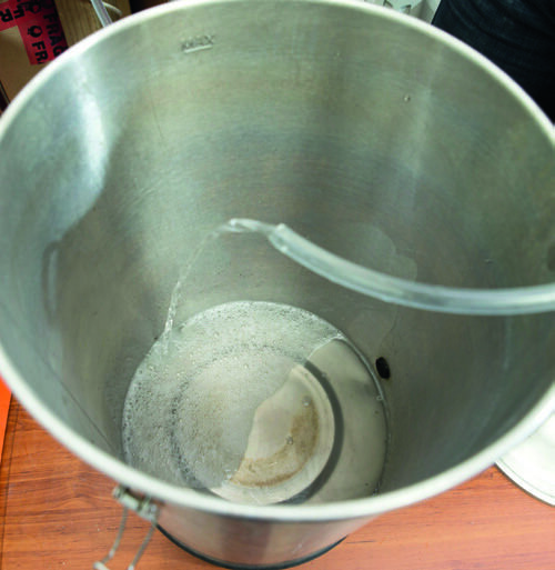 Siphoning wash into still