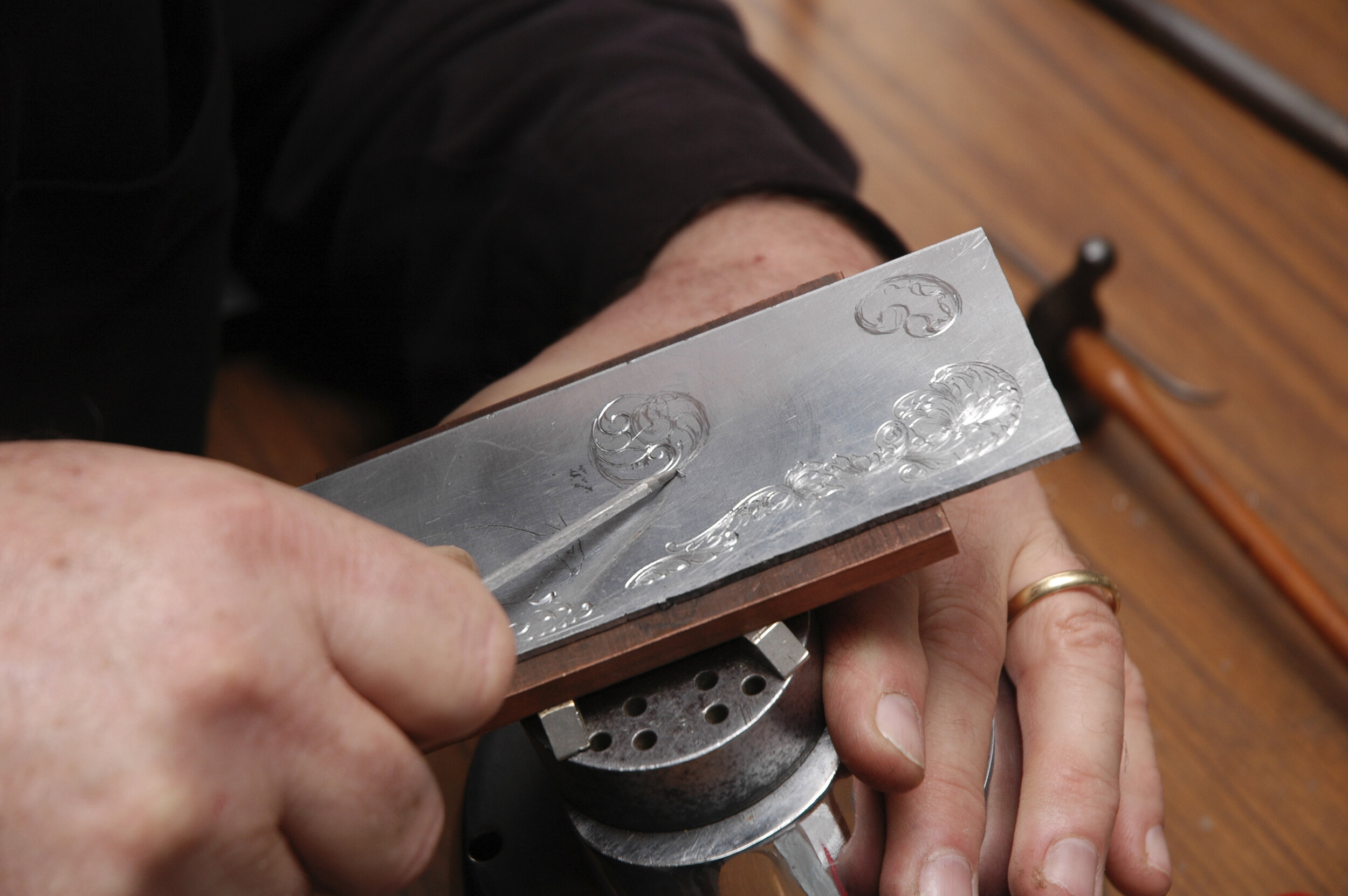 The metal should peel off as here. At the end of the stroke give the graver a flick to dislodge the swarf