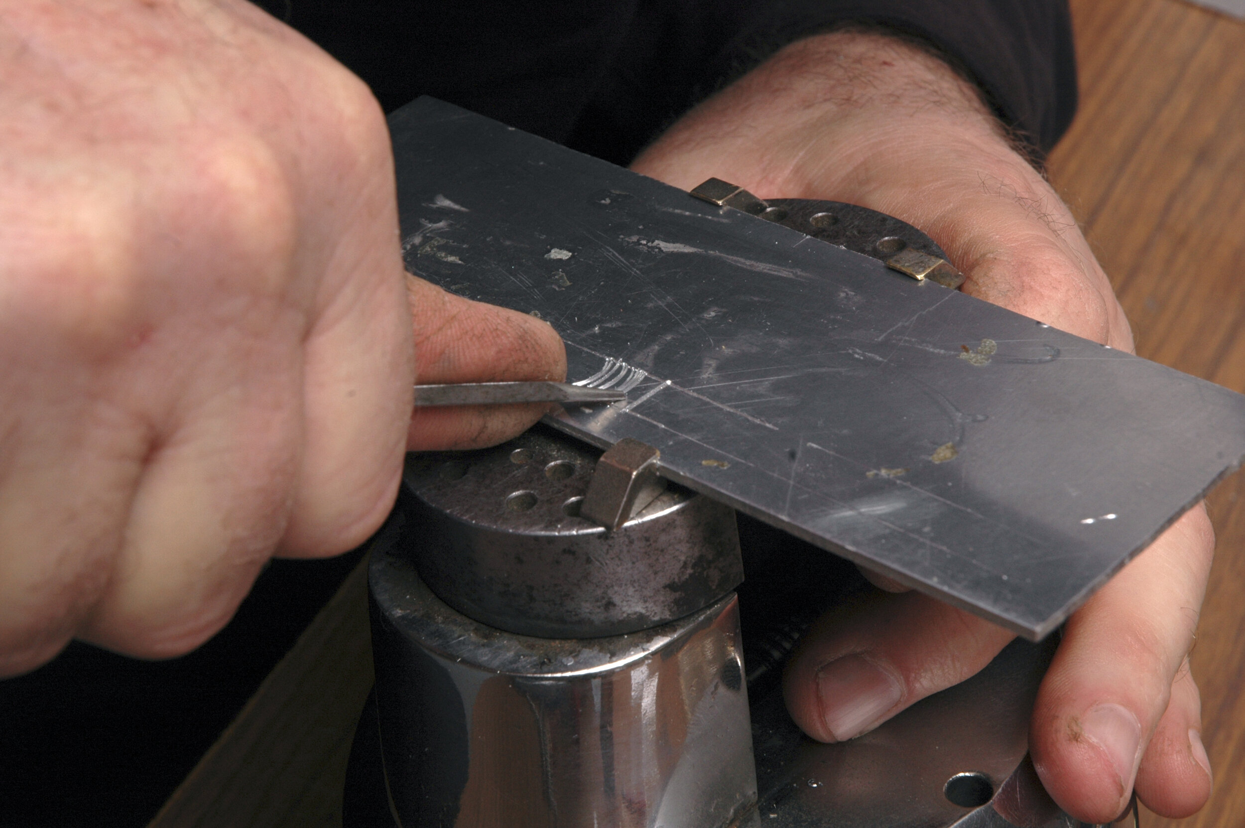 To cut curves, the work is rotated towards the cutter