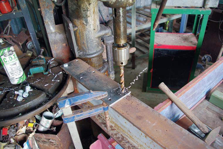 Stanchion plate drilled on I-Beam to match