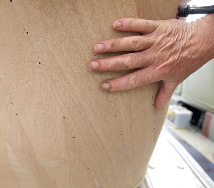 Where the body curves, the ply has been fitted in strips that are twisted on an angle to stop the edges protruding.
