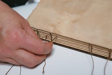 Second needle and thread through gap...