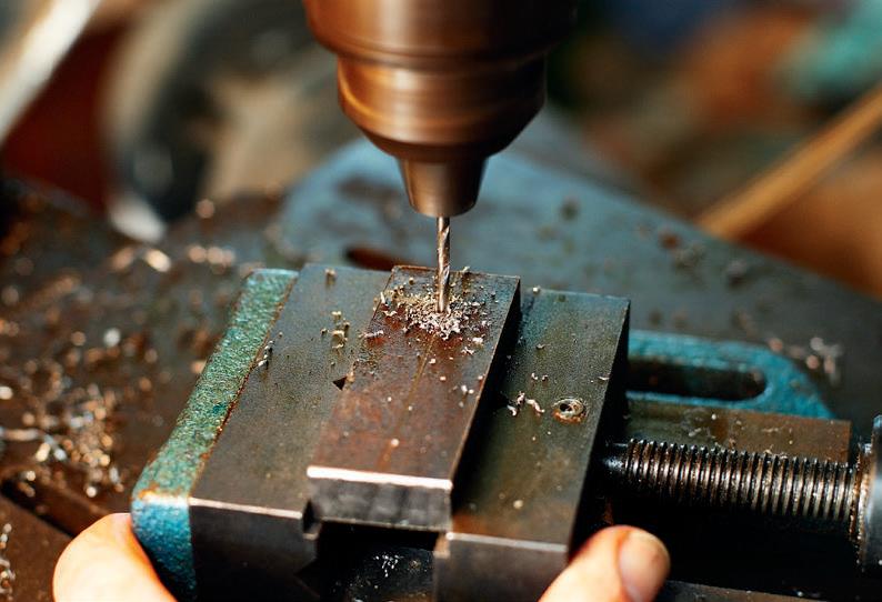 Drilling pilot holes through the other side of the support block