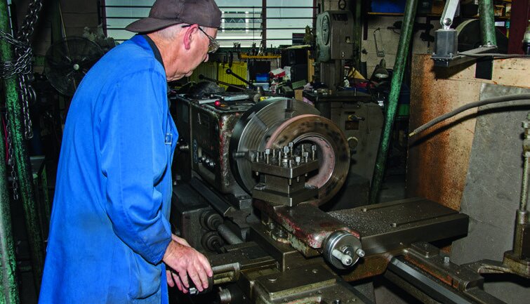 Bob machines the disc surface so that it sits flat on the ground.