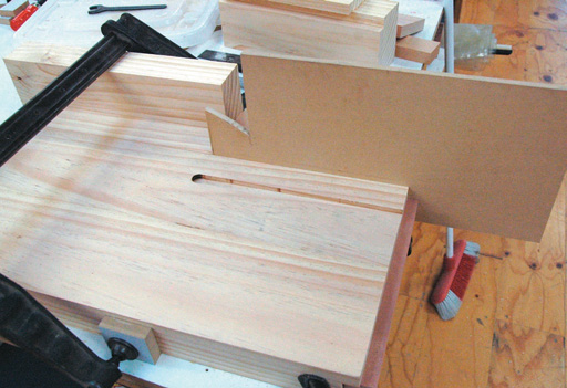 Improvised fence for router when running groove in underside of bench