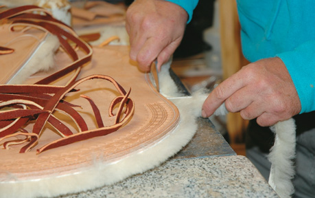 Trimming excess wool from the skirt