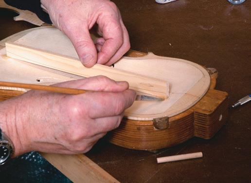 Temporarily gluing scribed bass bar.