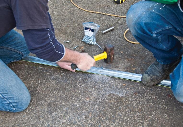 “Nailing” the track in place