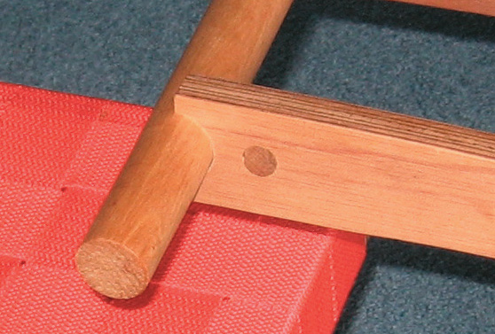 Dowel glued across ply at right angles to screw hole