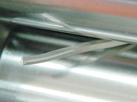 Milling silver rod in ﬂat rollers.