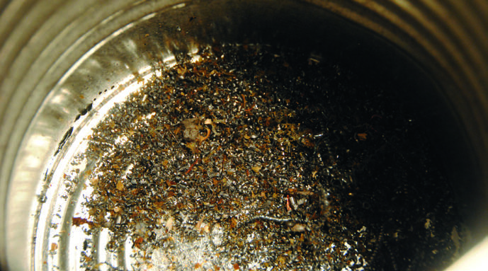 The collected swarf in the coffee tin.