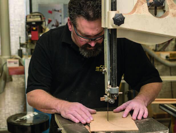 Cutting an MDF template of the curve of the wing on the bandsaw