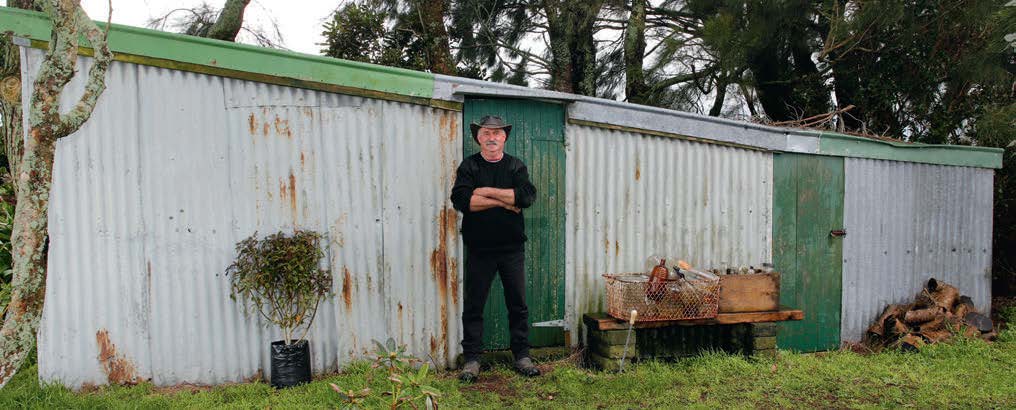 Gary and one of his sheds full of bikes and parts. Note the lean to on the lean to on the lean to.