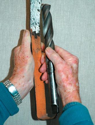 Morse taper drill gauge. The lines scratched on the chalked area by the cutting wings should match. Note spike ﬁ tting in the end of the drill.
