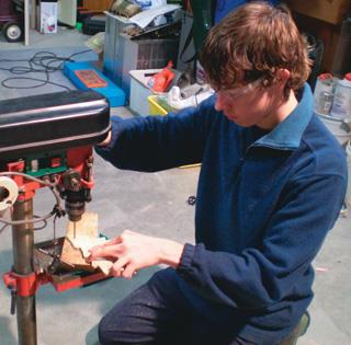 Drilling holes for LEDs.