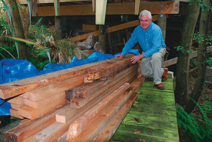 Recycled rimu stored flat, out of the weather.