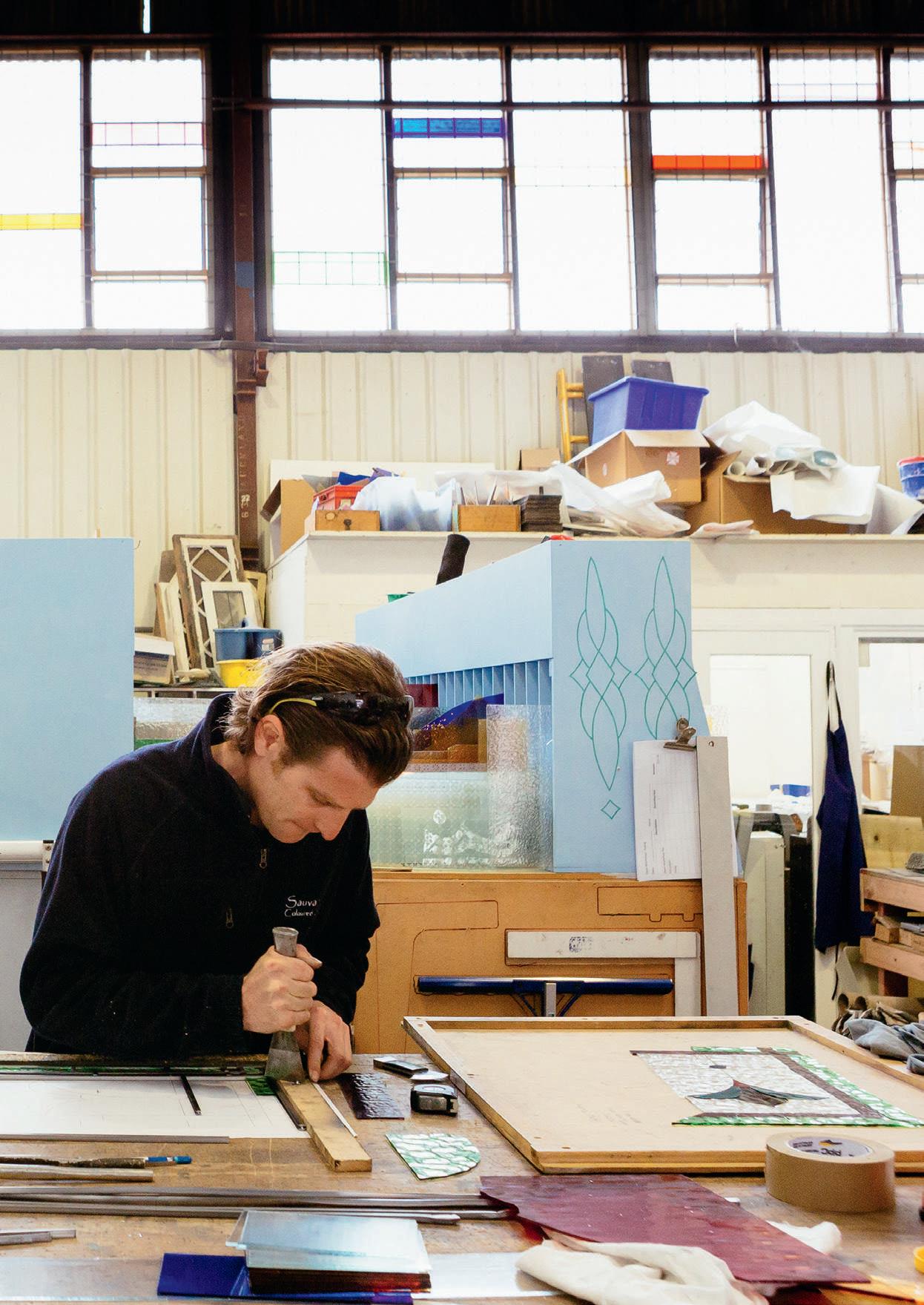 Myke Bakker at work at Sauvarins Coloured Glass Studio.