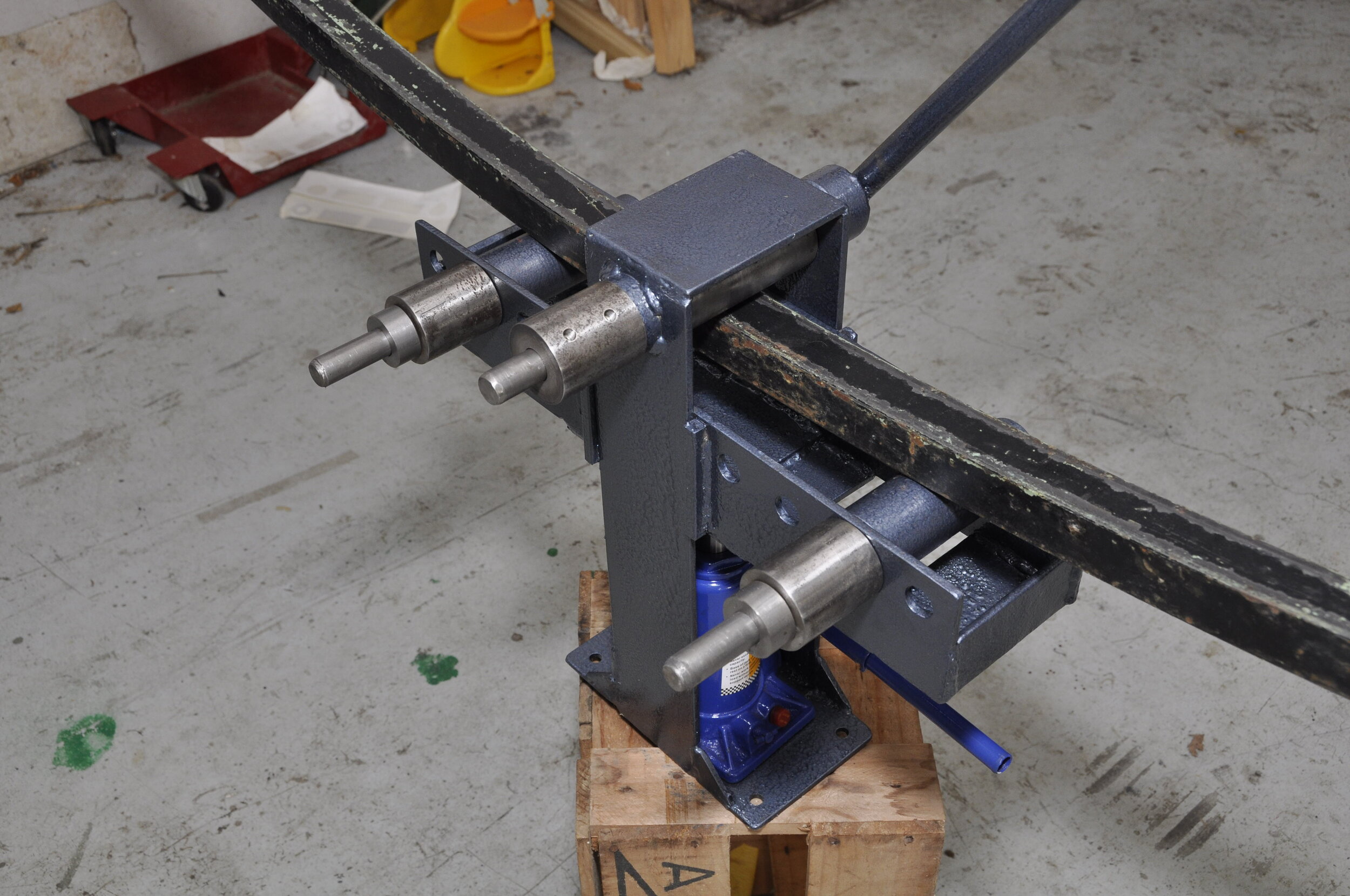 Ring roller with steel section being curved, back view…
