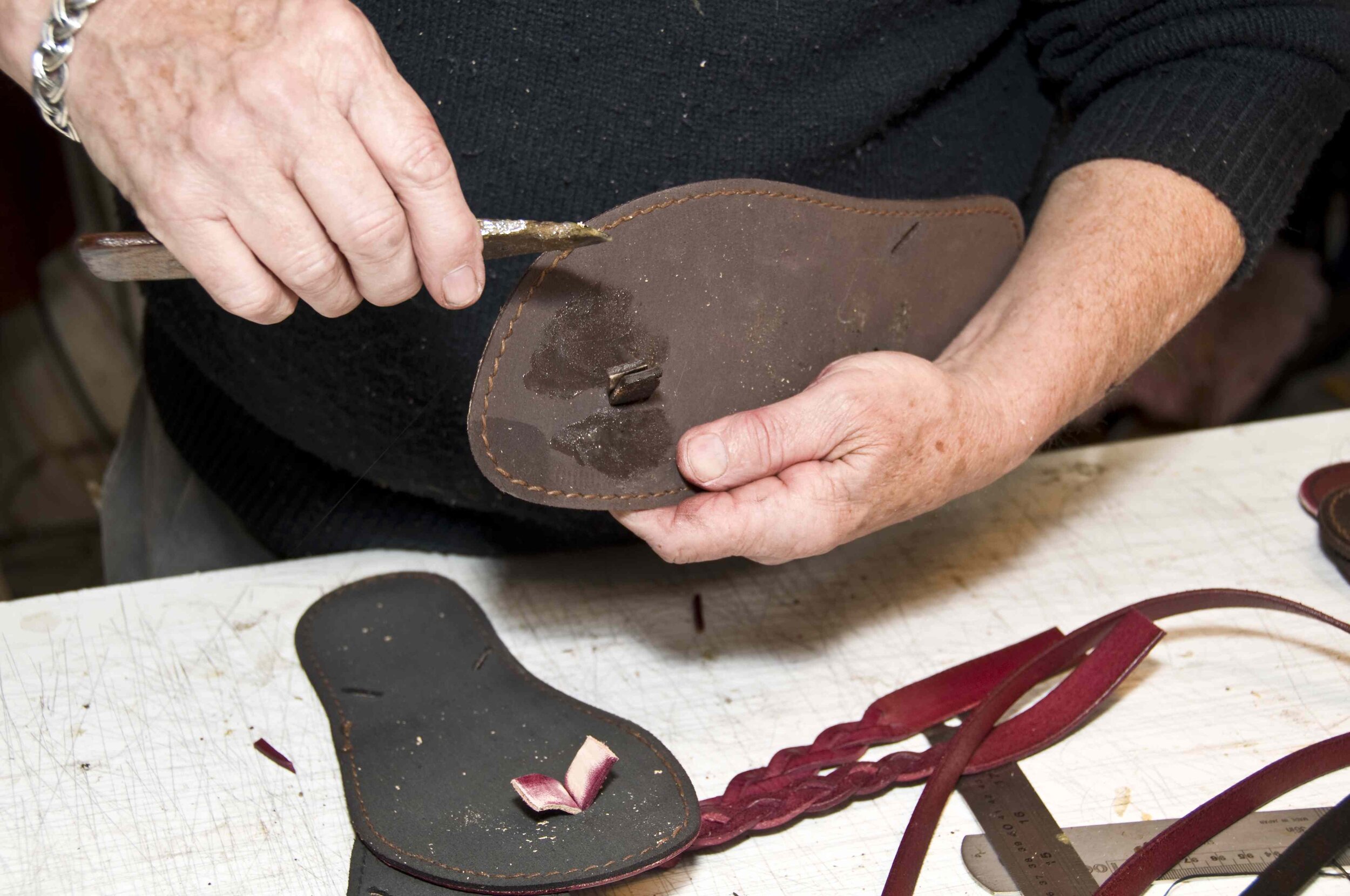 Fitting the toe end of the jandals. Note the ends of the straps have been roughened