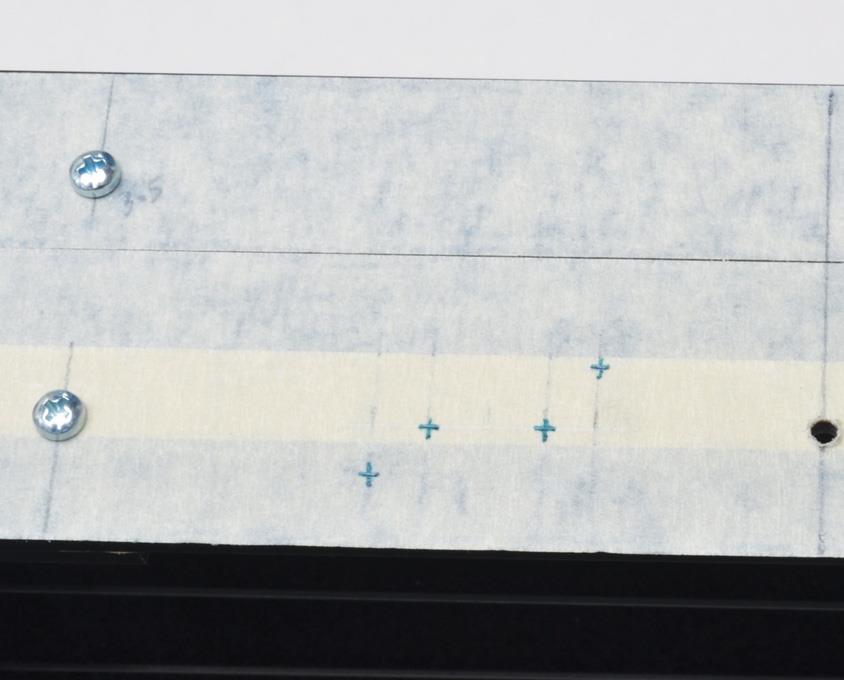 Holes marked for button board.
