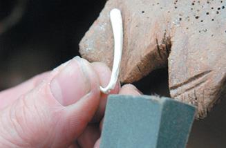 Soften with emery paper.