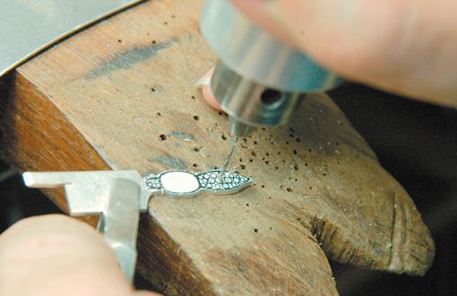 Drill out punch marks.