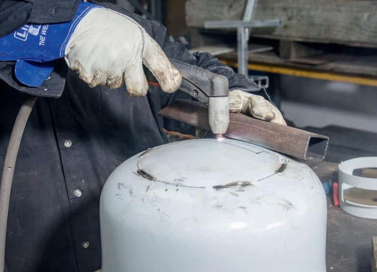 Using a straight edge to cut the rear opening.