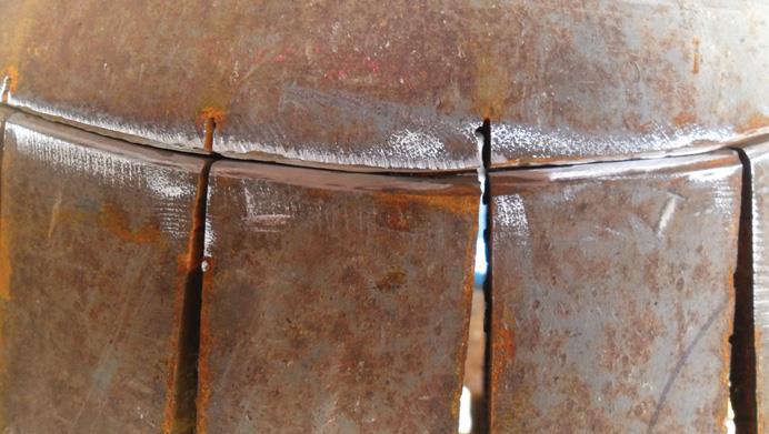 Nicks in base of strips to aid bending.