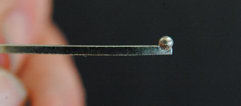 Antenna has shot soldered into half groove.