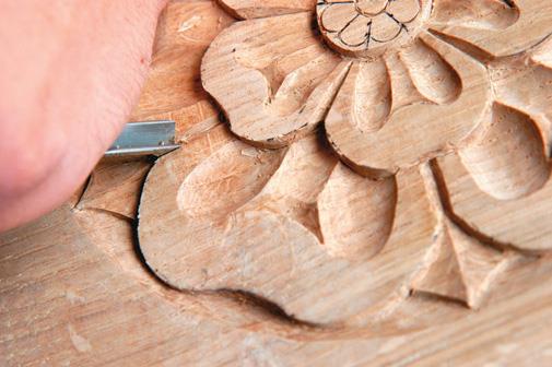 Carve down towards the cut to clear waste