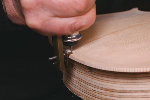 Mini-router cuts purfling channel.