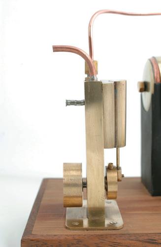..and sides.  The spring over the screw provides tension to keep the mating surfaces in contact.