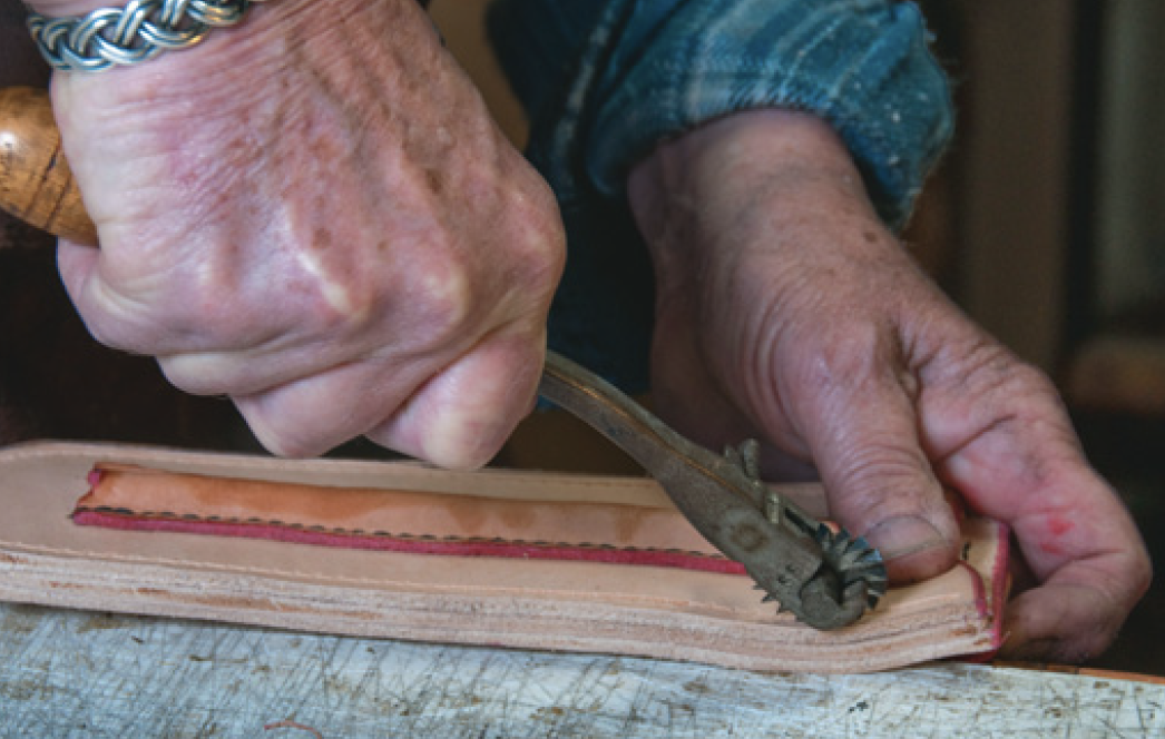 Pricking stitch holes.