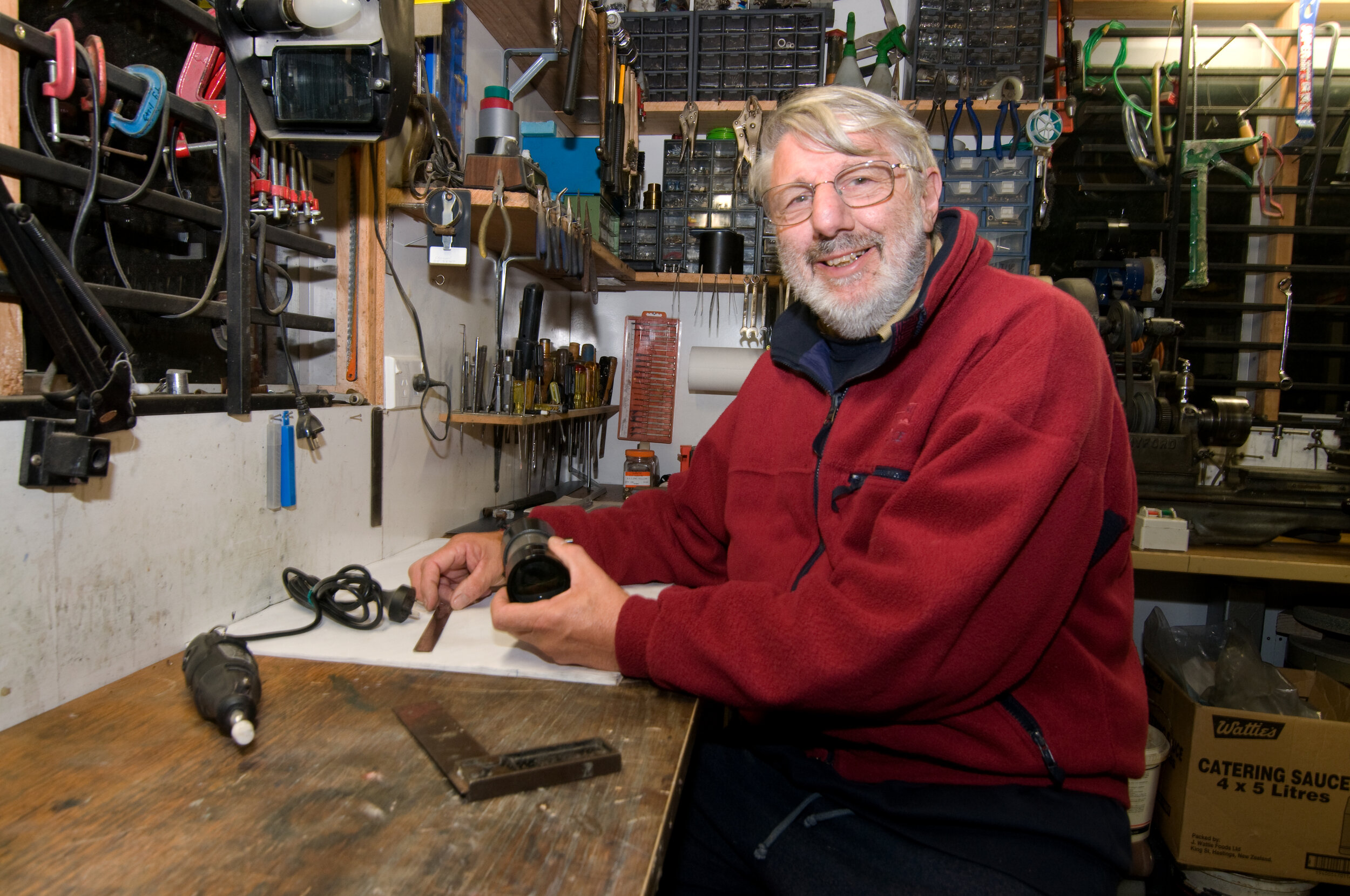 Telescope maker and restorer Gordon Hudson in his “shed.”