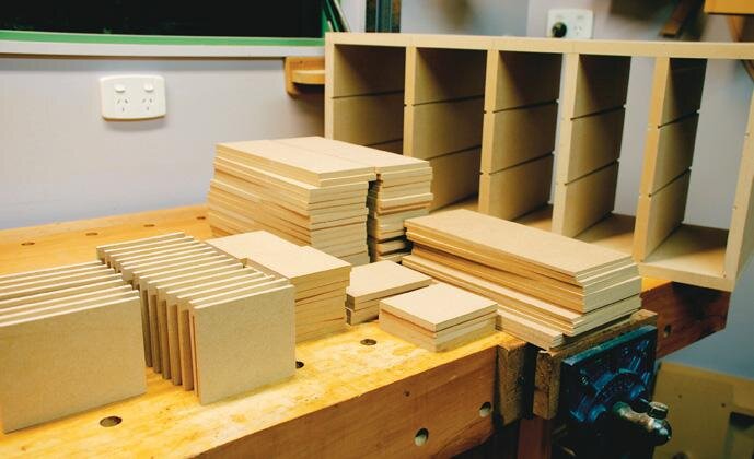 Drawer components in front of the assembled cabinet