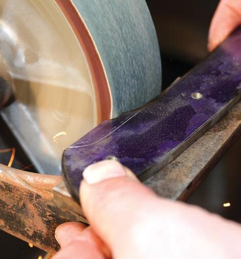 Belt over edge of wheel grinds small corners