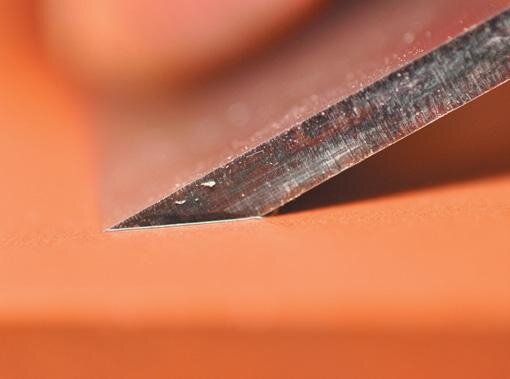 Setting the heel and toe of the hollow grind onto the coarse stone