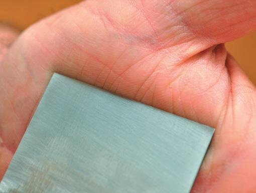 Final removal of the burr by drawing blade downwards