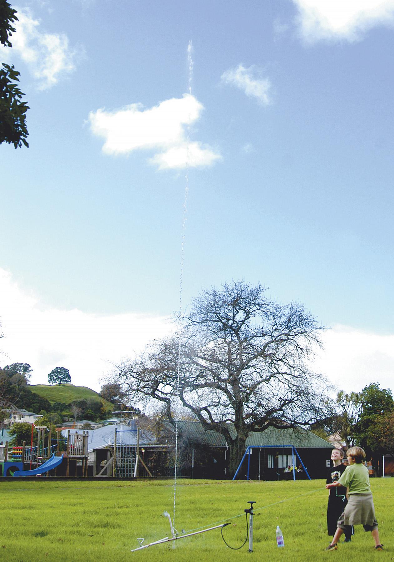 Lift off. Eight-year-olds Marshall and Finn launch the water rocket. Dad watched from the wings