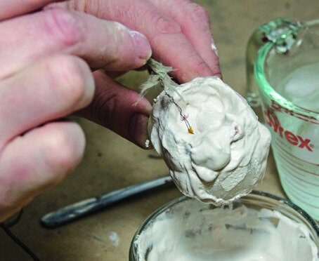 Placing a thermocouple into the mould to monitor the temperature inside